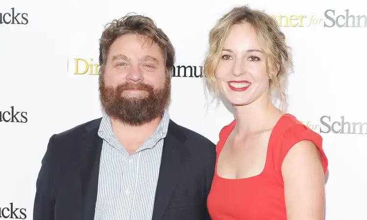 Quinn Lundberg with her husband, Zach Galifianakis on a red carpet. 